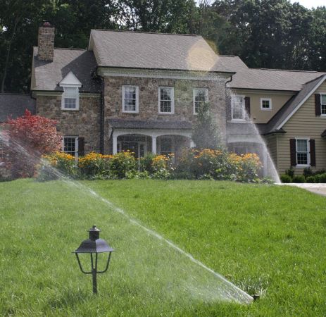 Sprinklers in front yard landscaping - Burkholder Landscape