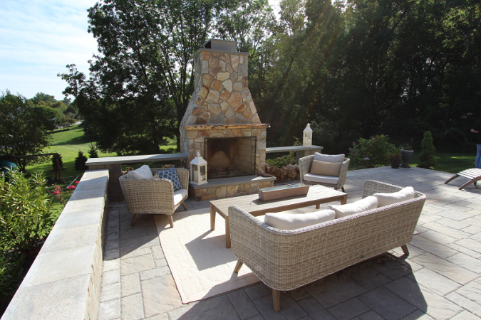 Outdoor Fireplace with Seating Area on Natural Stone Patio - Burkholder Landscape