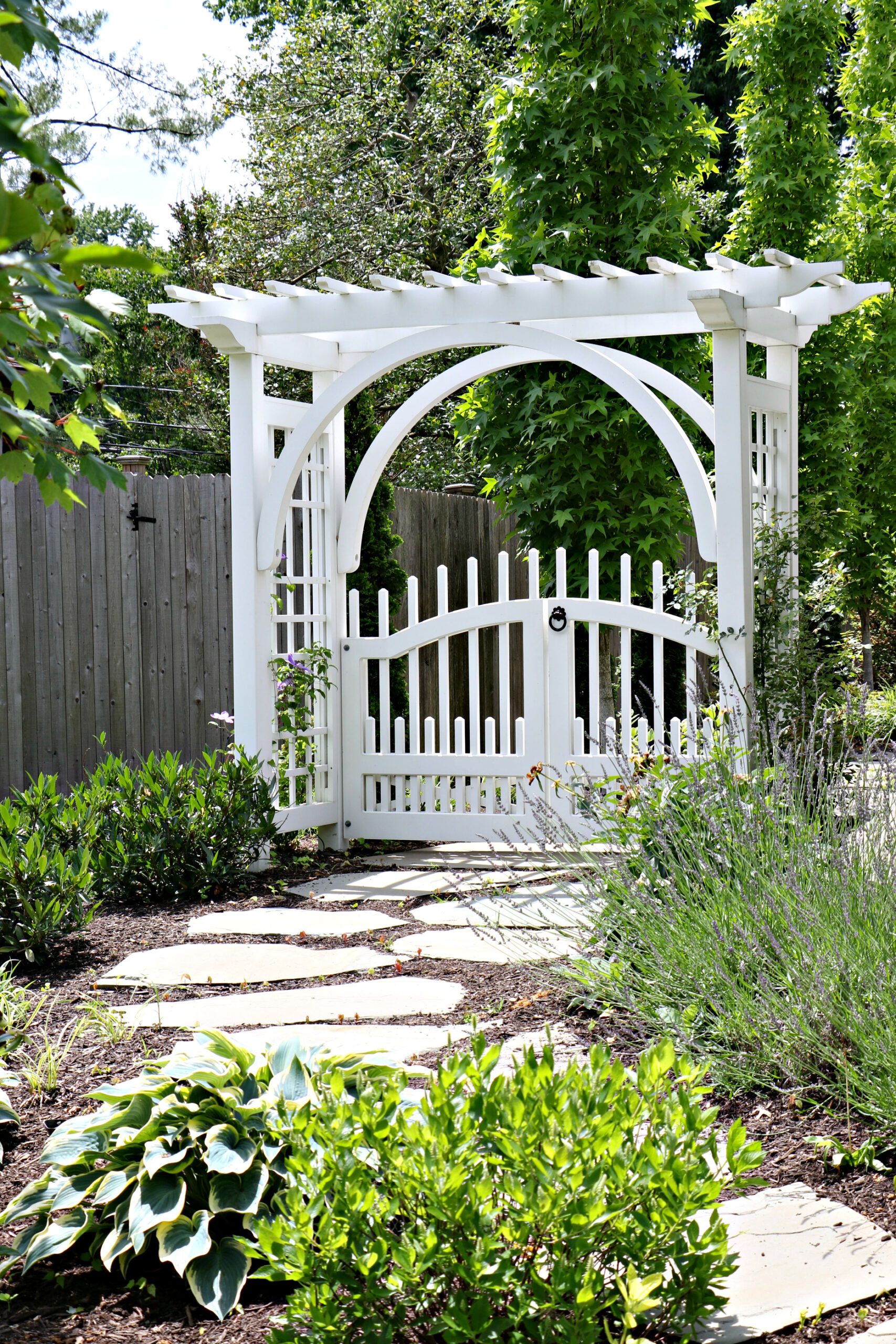 Walkway leading to arbor by Landscape Design Firm Burkholder Brothers Landscape