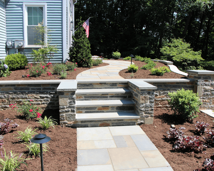 landscaped walkway with stairs leading to backyard -Burkholder Landscape