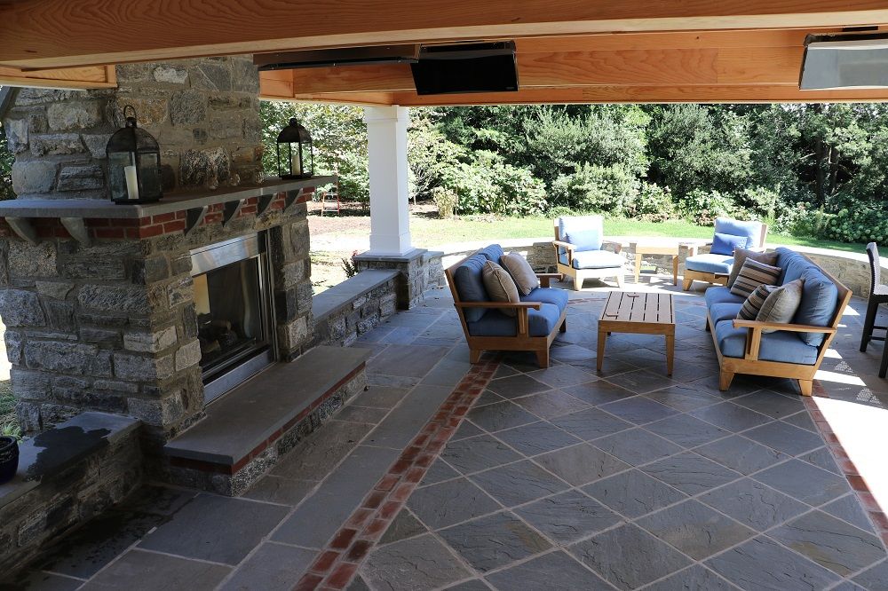 patio design - fireplace on patio under pavilion