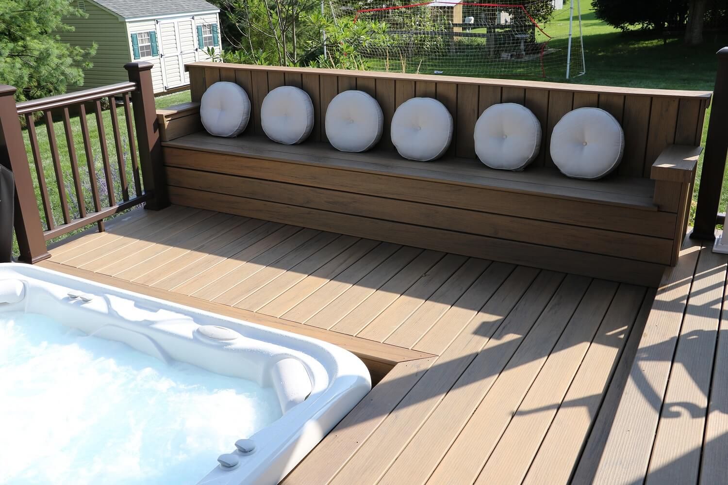 Built in seating and spa on a custom deck | Burkholder Landscape
