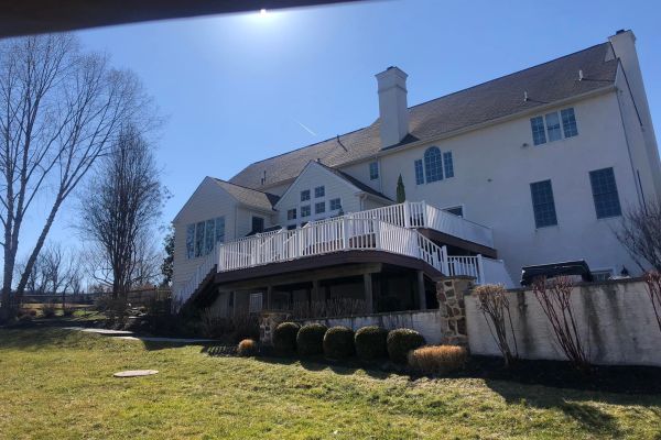 rearview of a home with deck | Before Picture of ew Landscaping Project In Malvern | Burkholder Landscape