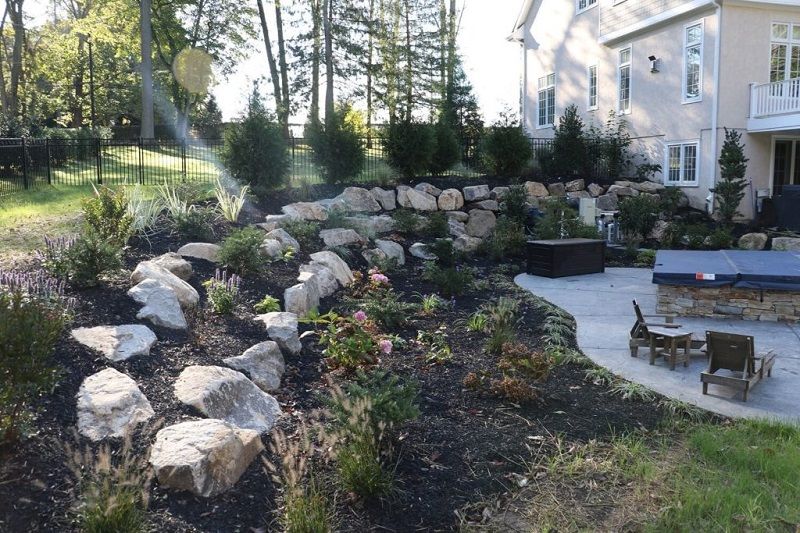 Retaining soft planting boulder wall | February landscaping tips | Burkholder Brothers