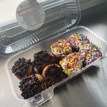 Container of topped donuts by East Coast Mini Donuts - Burkholder Holiday Market 2022