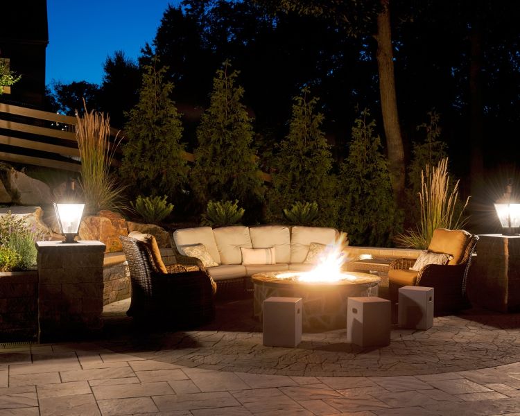 Lighting (Firepit) Up-lighting on trees, cap lights on wall and pillar lights