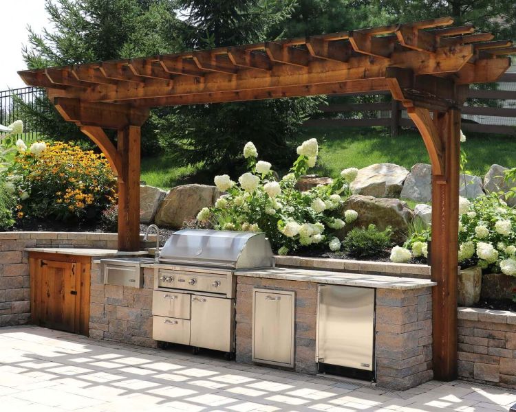 Techo-Bloc Outdoor Kitchen with Sink, Gas Grill, Trash, and Fridge with Cedar Pergola and Cabinet