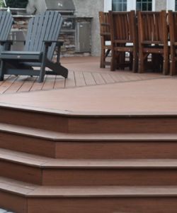 Custom deck with hot tub built in | Landscape Design Companies like Burkholder design and build beautiful custom decks