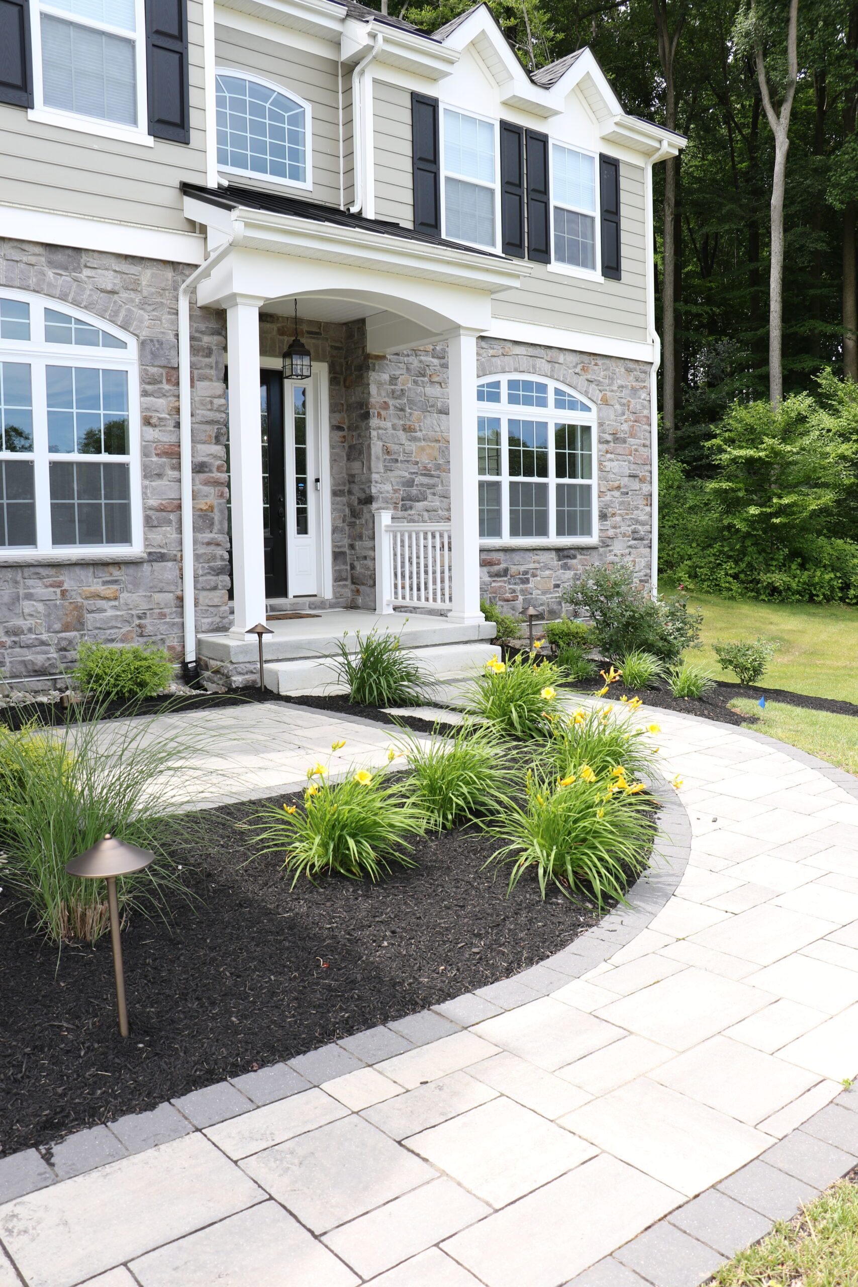 Walkway leading to home by Landscape Design Firm Burkholder Brothers Landscape