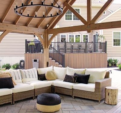 White Sectional couch in outdoor pavilion | Burkholder's Landscape Design Process