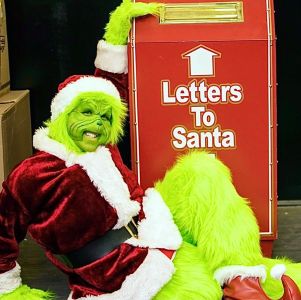 Grinch visiting the Burkholder Annual Holiday Market
