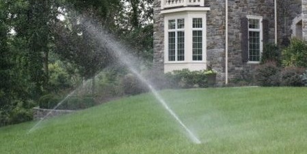 Lawn with irrigation system running | Spring Activities for Your Landscape | Burkholder Brothers