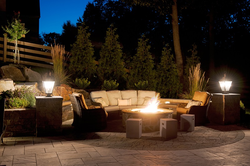 Lounge area with firepit at night | outdoor firepit | Burkholder Brothers