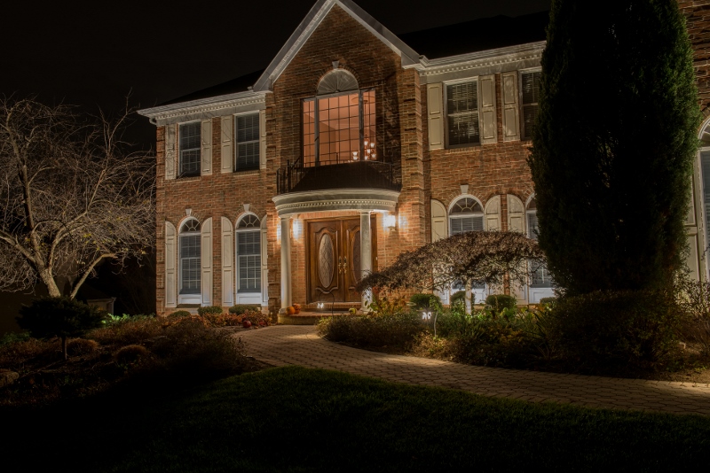 Exterior of house with outdoor lighting | Holiday Tips | Burkholder Brothers