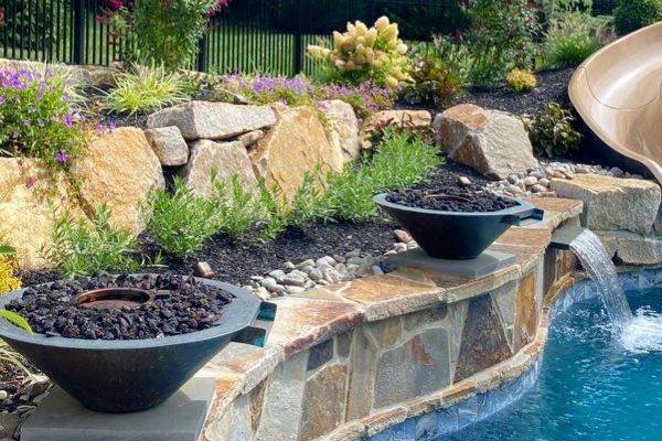 Pool seat walls and steps using Techo-Bloc 6&rdquo; Mini Creta Architectural caps in beautiful chestnut brown - Pool and Patio Retreat - New Projects by Burkholder Landscape